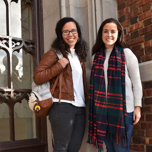 Students smiling in front of Benedictine Hall